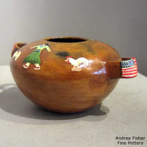 American flag handles and a Navajo yard scene on a polychrome jar