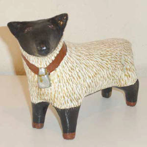 Sheep figure in black and white with pine pitch coating