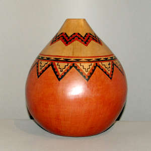 Square opening and Navajo carpet design on a brown jar