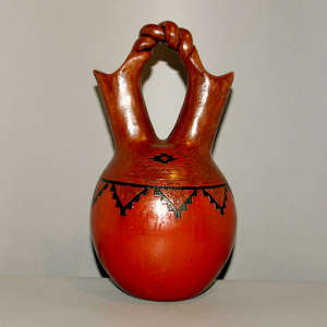 Twisted handle and Navajo carpet design on a brown wedding vase