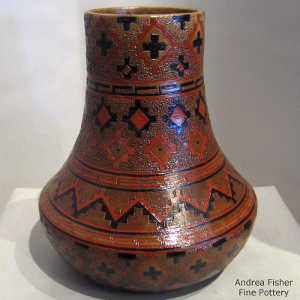 Navajo rug design on a tall neck brown jar