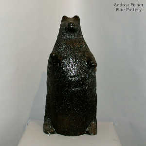 Pine pitch coats this large bear coin bank