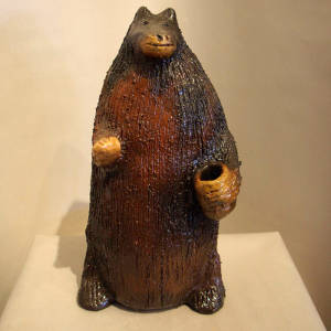 Bear figure coated with pine pitch