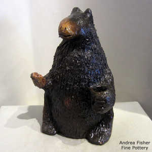 Pine pitch coats this medium bear coin bank