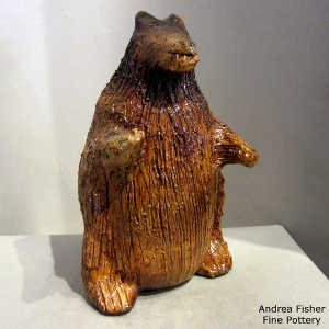 Pine pitch coats this medium bear coin bank