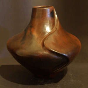 Carved ridge and fire clouds on a brown jar