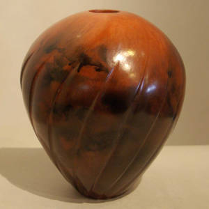 Fire clouds on a large Navajo melon seedpot