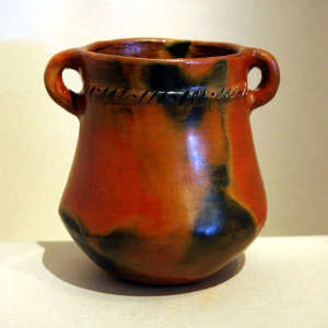 Fire clouds and pine pitch coating on a brown jar with handles