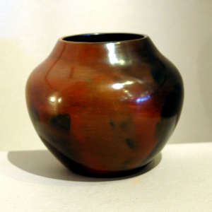 Fire clouds and pine pitch coating on a brown jar