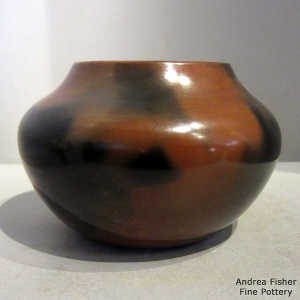 Fire clouds and pine pitch coating on a brown jar