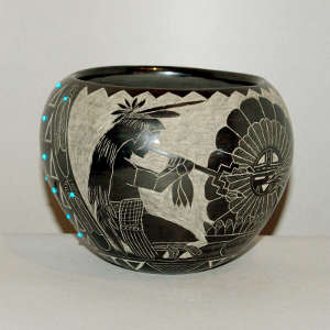 Sgraffito Sioux design on a black jar