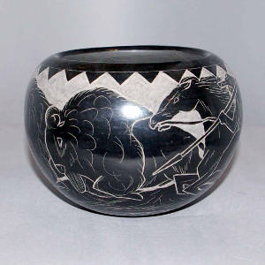 Sgraffito buffalo hunt scene and kachina face medallion on a black jar