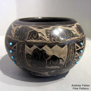 Sgraffito bison, feather and geometric design on a black jar with stone inlays