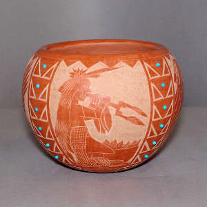 Sgraffito Sioux design and inlaid blue stones on a black jar