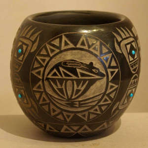 Sgraffito bear, bear claw and geometric design plus inlaid faux turquoise on a black jar