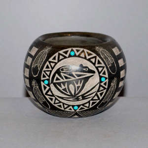 Sgraffito Sioux bear, feather and geometric design on a black jar with faux turquoise inlays