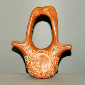 Sgraffito hummingbird, flower and geometric design on a red wedding vase