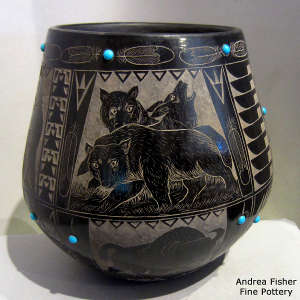 Sgraffito wildlife, nature and Sioux design on a black jar with inlaid stones