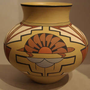 Three turtle medallions and geometric design on a polychrome jar