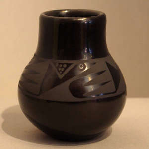 Geometric designs on a black on black jar