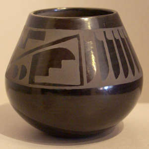 Feather and geometric design on a black on black jar