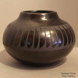 Feather design on a black on black jar