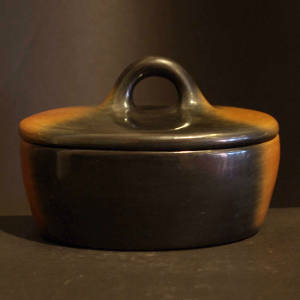 Polished black and brown lidded jar