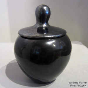 Plain polished lidded black jar