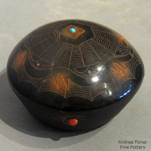 Sgraffito avanyu, spider web and geometric designs plus inlaid coral and turquoise on a black seedpot with sienna spots