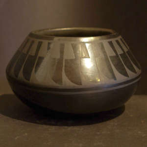 Feather design on a black on black jar