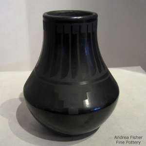 Kiva step and feather design on a black on black jar