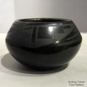 Kiva step and geometric design on a black on black jar