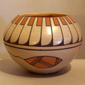 Feather and tadpole design on a polychrome jar