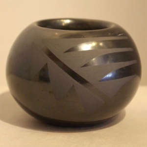 Geometric design on a black on black jar