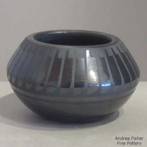 Feather design on a black on black jar