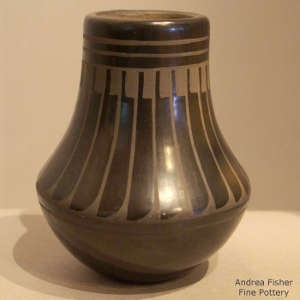 Feather design on a black on black jar