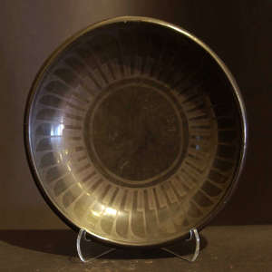 Feather design on a black on black plate