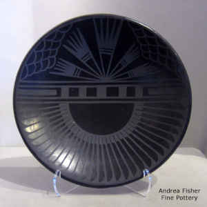 Feather and geometric design on a black on black plate