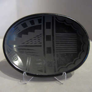 Geometric designs on a black on black plate