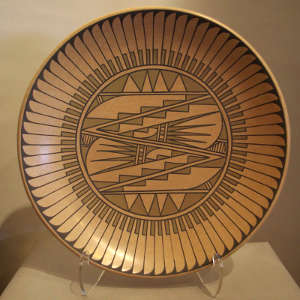 Feather and geometric design on a polychrome plate