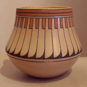Feather and geometric design on a polychrome jar
