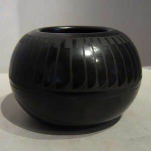 Feather design on a black on black jar