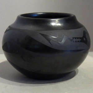 Avanyu design on a black on black jar