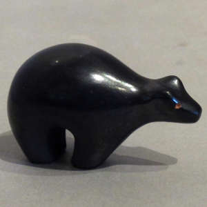 Red eyes on a black bear figure