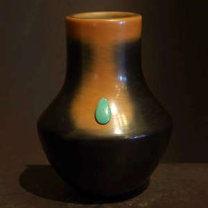 Turquoise inlay in a black and brown jar