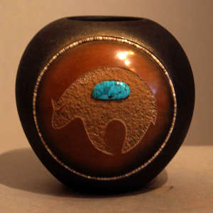 Sienna spot, sgraffito bear design and inlaid coral and turquoise on a black jar