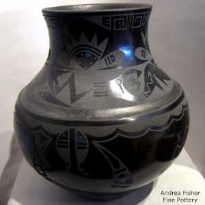 Avanyu and geometric design on a black on black jar