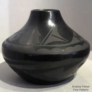 Geometric design on a black on black jar