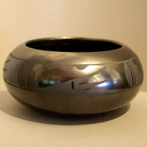 Band of geometric design on a low black bowl