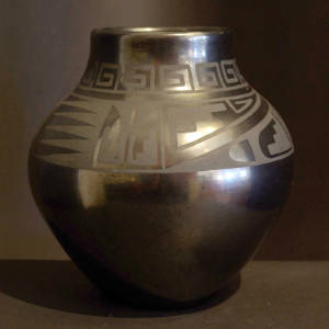 Geometric designs on a black on black gunmetal jar